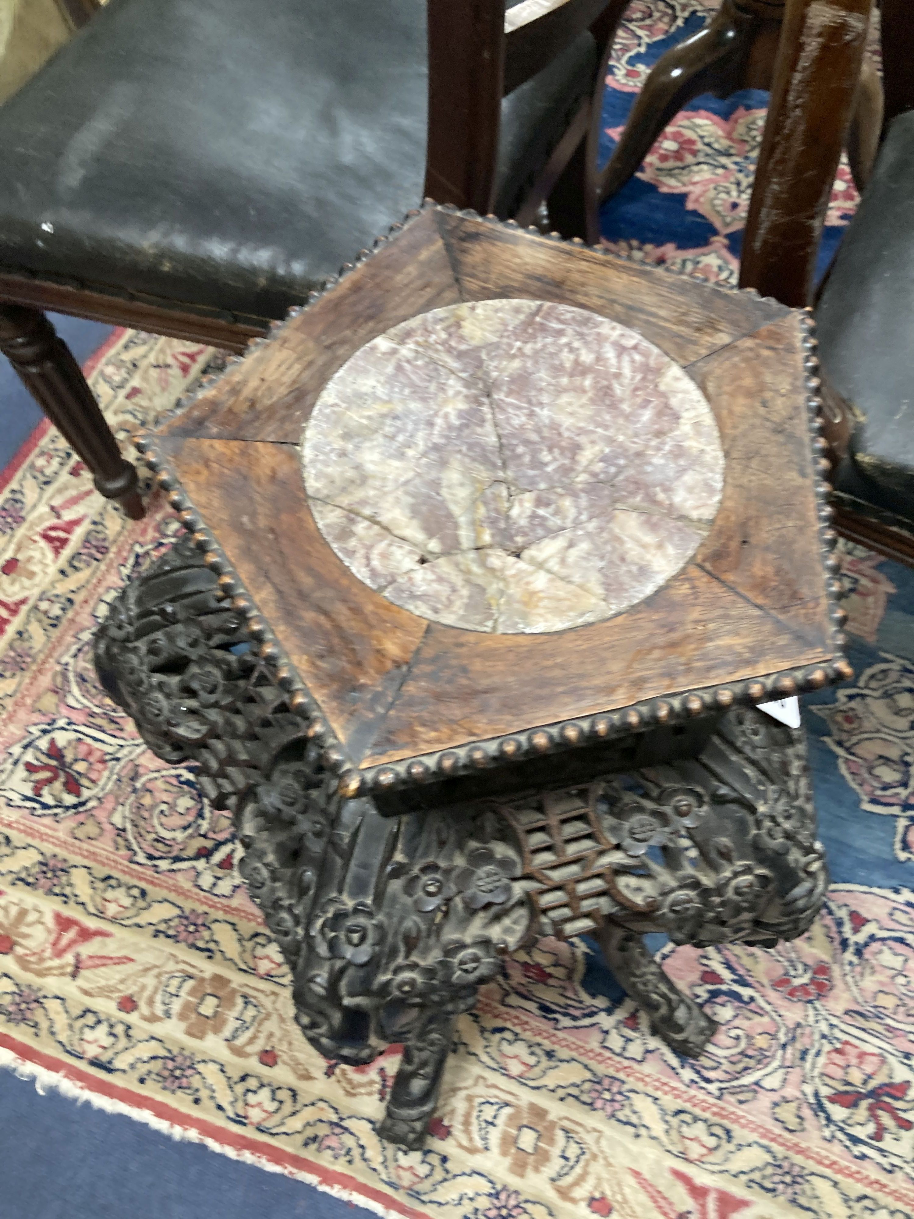 A late 19th/early 20th century Chinese carved jardiniere stand, 65cm. high